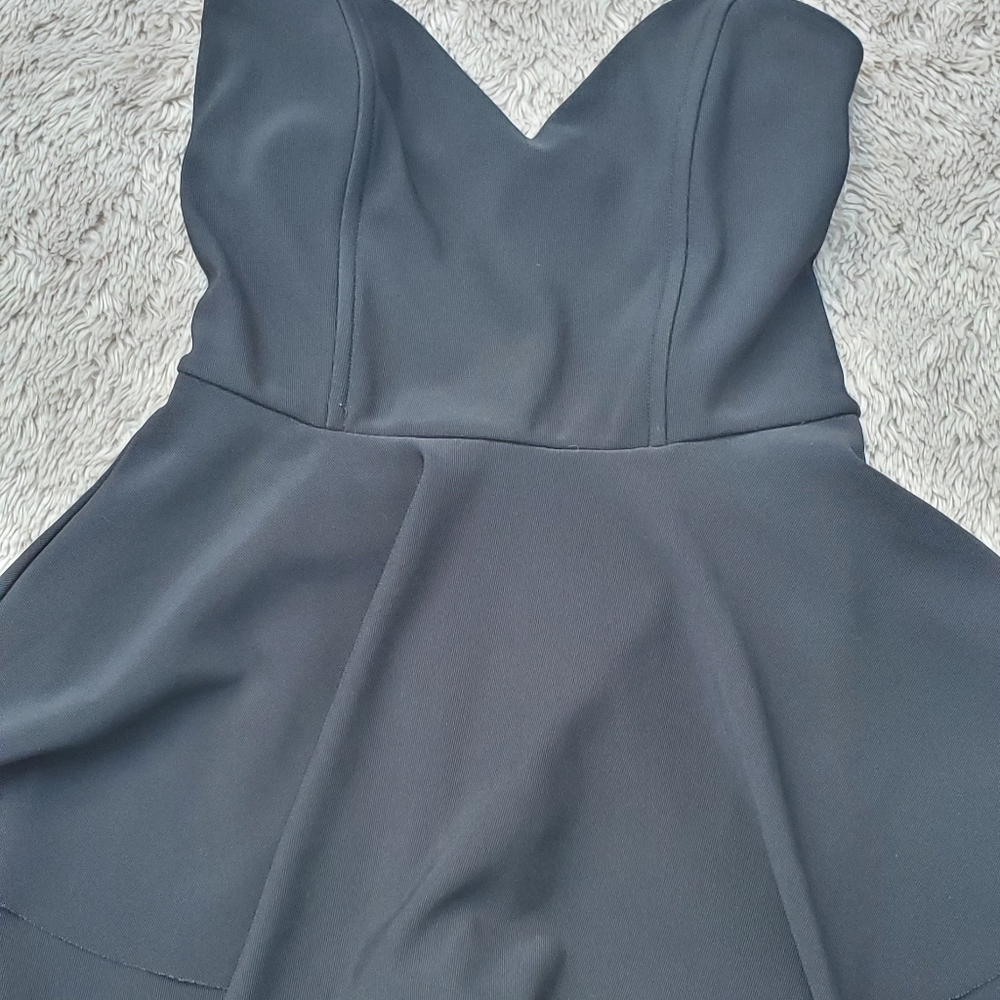 Black Romper with skirt overlay.